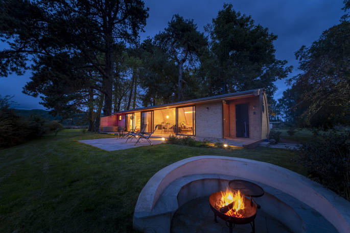 Rowan Cabin at night with firepit, Clifford, Hereford, Herefordshire - photo by Alex Treadway