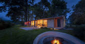 Rowan Cabin at night with firepit, Clifford, Hereford, Herefordshire - photo by Alex Treadway