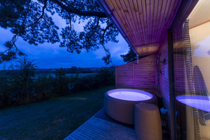 Rowan Cabin hot tub at dusk, Clifford, Hereford, Herefordshire - photo by Alex Treadway
