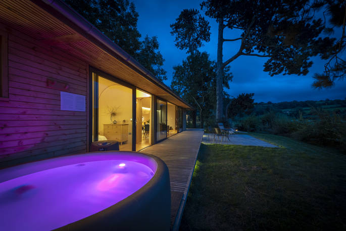Willow Cabin hot tub at night, Clifford, Hereford, Herefordshire, England - by Alex Treadway
