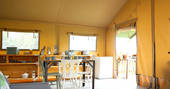 Dining and sofa area inside the safari tent at Drover’s Rest farm in Herefordshire
