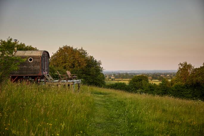 Deck chairs overlooking hills