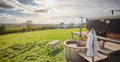 Hot tub with a view of the rolling hills. Outdoor picnic bend on the grass