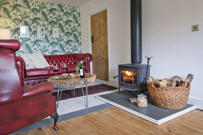 The Nook cabin cosy living room with wood burner at Kaya at Blackhill Farm, Craswall, Herefordshire