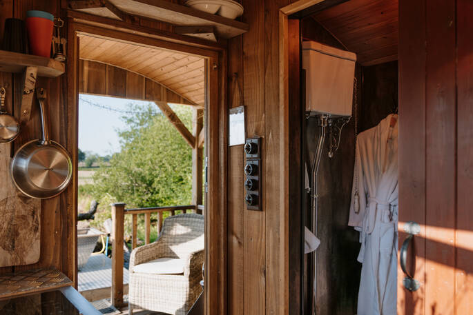 Bathroom with shower, sink and flushing toilet