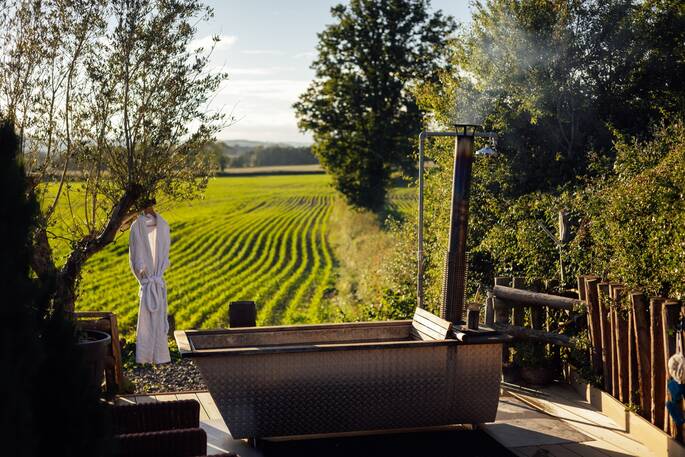 2 Outdoor bath with view across fields