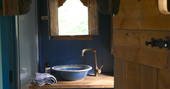 Bathroom facilities and sink at Myrtle shepherd's hut in Herefordshire