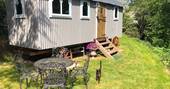 Sit outside the shepherds hut at the picnic table and enjoy the sun at Myrtle in Herefordshire 