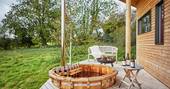 corner house pencombestone herefordshire glamping cabin deck sunken hot tub with countryside view