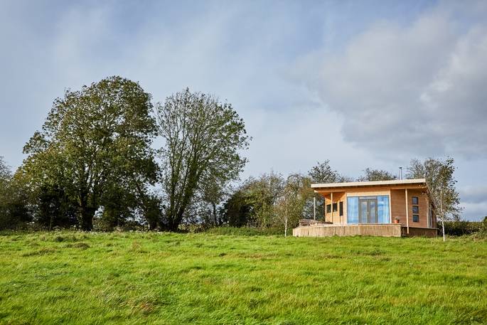 cabin herefordshire glamping exterior view decking with hot tub