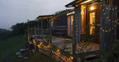 The Wagon Above the World during the night with fairy lights, glamping, Orcop, Herefordshire