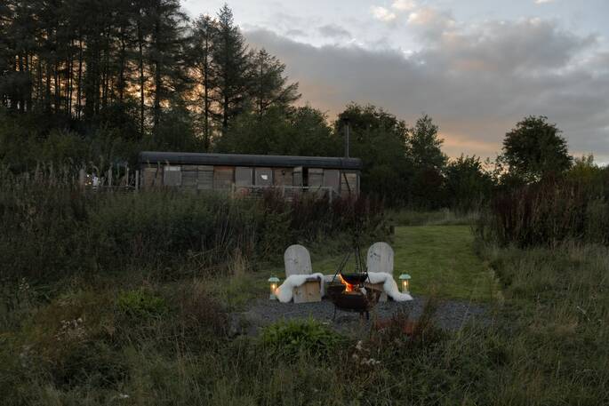 Cabin and fire at dusk 