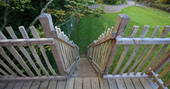 Wooden steps leading up to the lodge treehouse