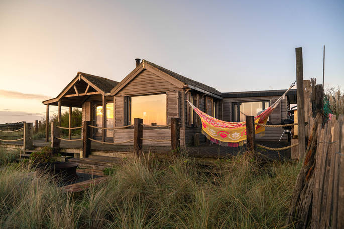 The Beach House cabin golden hour, Isle of Sheppey, Kent, England