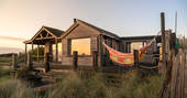 The Beach House cabin golden hour, Isle of Sheppey, Kent, England