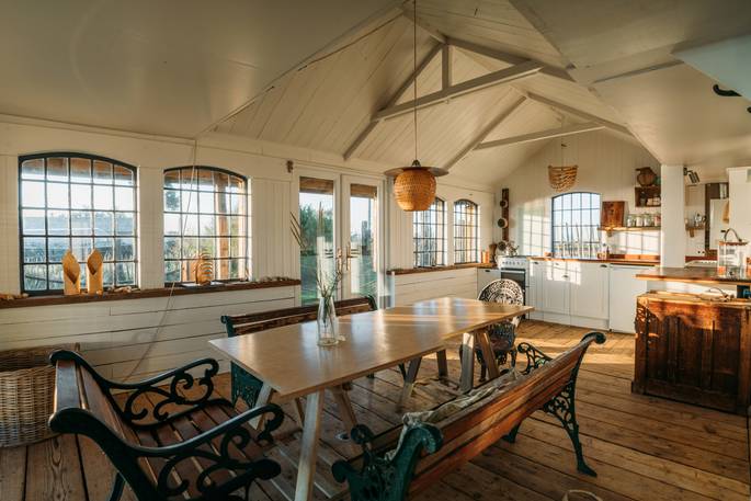The Beach House cabin kitchen and dining area, Isle of Sheppey, Kent, England