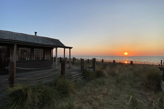 The Beach House cabin sunset, Isle of Sheppey, Kent, England