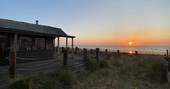 The Beach House cabin sunset, Isle of Sheppey, Kent, England