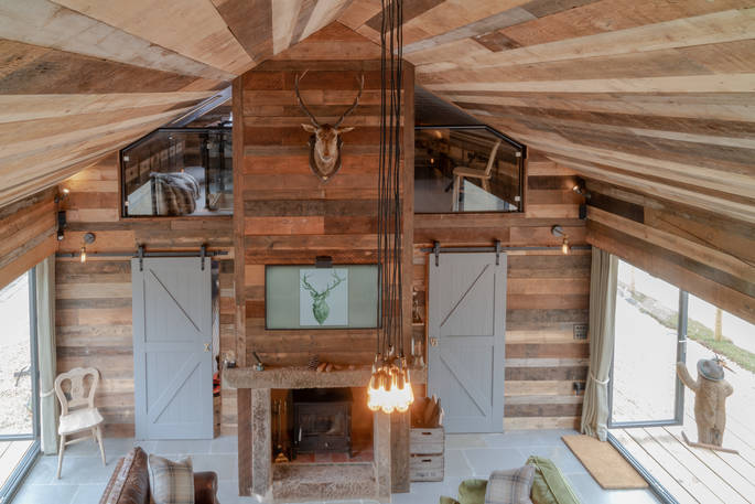 Interior of Knotting Hill Barn House living space area from the mezzanine level 