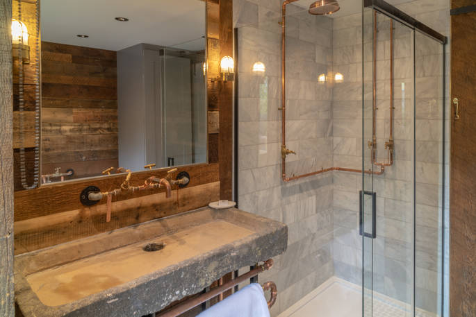 Shower and sink in one of the two bathrooms inside Knotting Hill Barn House in Leicestershire 