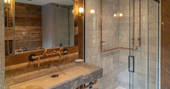 Shower and sink in one of the two bathrooms inside Knotting Hill Barn House in Leicestershire 