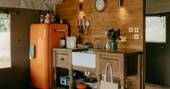 Kitchen equipped with a fridge freezer, gas hob, kettle, toaster