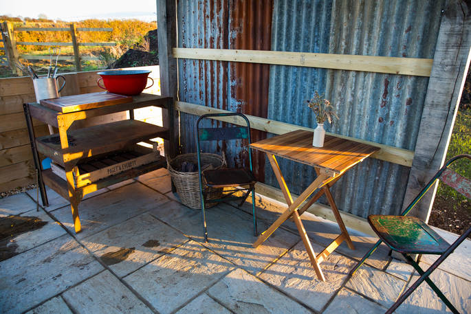 Sit outside next to the shepherd's hut at Tin and Wood in Nottinghamshire 