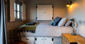 Unwind after a day at Tin and Wood in your cosy king-size bed at the end of your shepherd’s hut 
