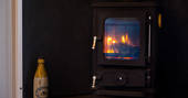 Sit by the roaring fire inside the shepherd’s hut at Tin and Wood in Nottinghamshire 