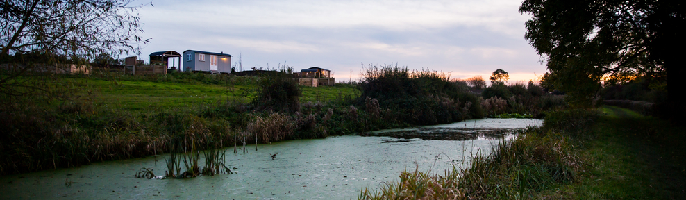 The Tin and Wood Huts positioned beautifully above the canal﻿