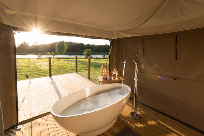 Run a hot bubble bath and take in the beautiful views of the lake at The Nest