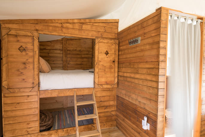 One king-size cabin bed inside your safari tent at The Nest 