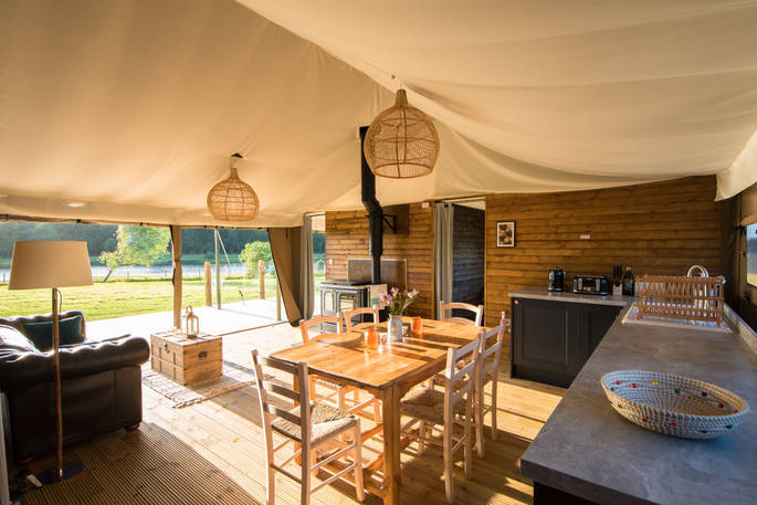 Open plan kitchen and living area space inside your safari tent at The Nest in Lincolnshire 