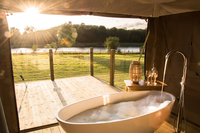Run a hot bubble bath and take in the beautiful views of the lake at The Nest 