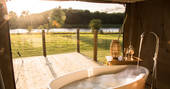 Run a hot bubble bath and take in the beautiful views of the lake at The Nest 