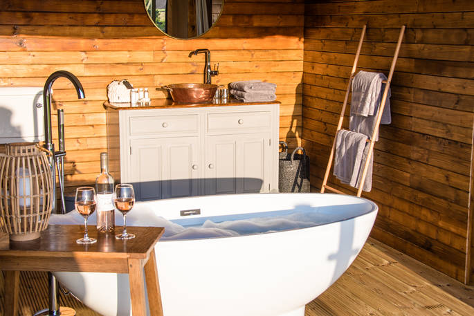 Run a hot bubble bath and take in the beautiful views of the lake at The Nest