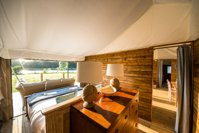 Spend your mornings lying in bed watching the wildlife go by inside your safari tent at The Nest