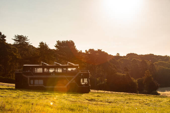 18 - Side shot of bus at dusk