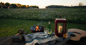 Relax with a glass of wine on the Oyster Catcher decking and watch the sunset at Bagthorpe Farm in Norfolk