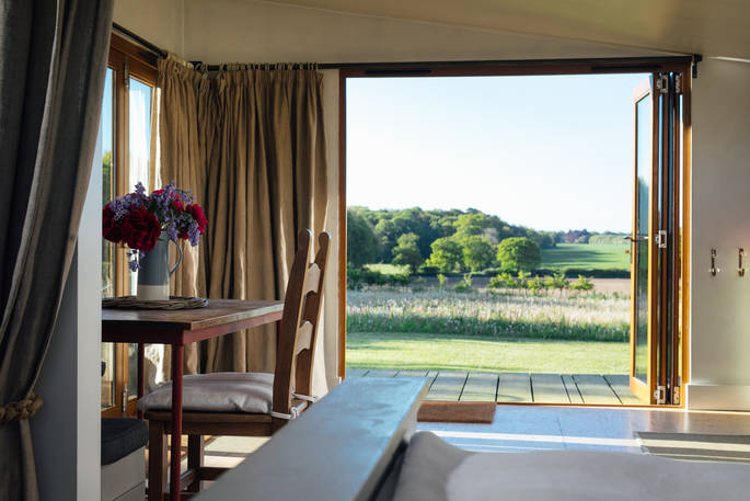 A beautiful view of the surrounding hills from your bed at the Woodcock Cabin in Norfolk