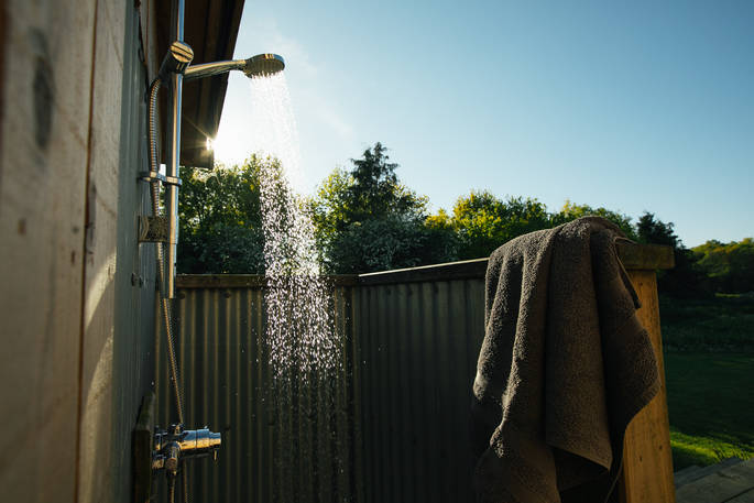 Be truly at one with nature by taking an outdoor shower at The Woodcock Cabin in Norfolk