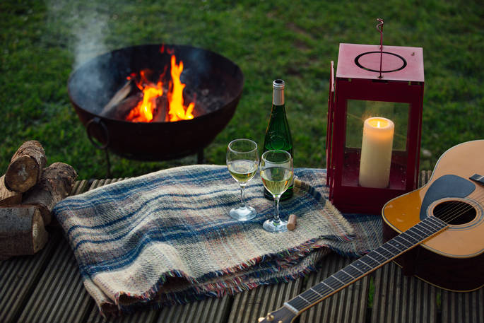 Relax and unwind by the fire pit at the Woodcock Cabin in Norfolk