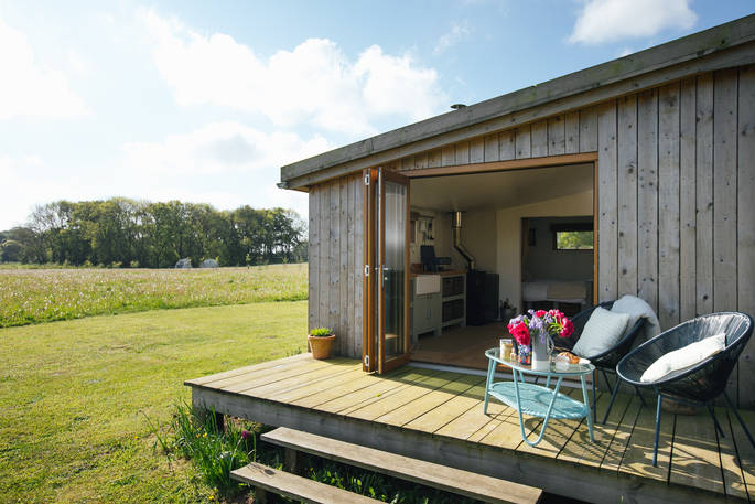 Relax and unwind on your own decking at the Woodcock Cabin in Norfolk