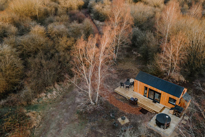 Birch View cabin drone view, The Wilding Airfield, Peterborough, Northamptonshire