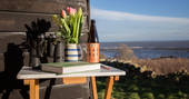 Sit outside the hut and read a book whilst enjoying the sea view in Northumberland 