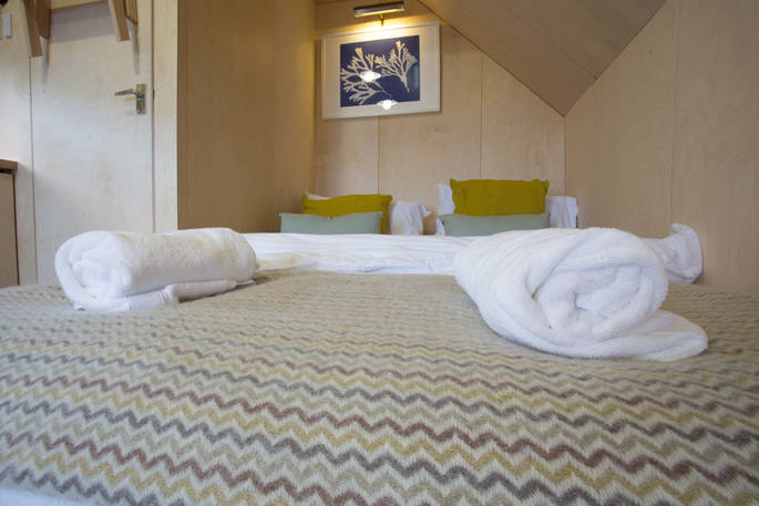 Comfortable double bed inside the Alnmouth Huts in Northumberland
