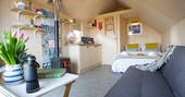 Light the wood-burner and relax inside the huts in Northumberland