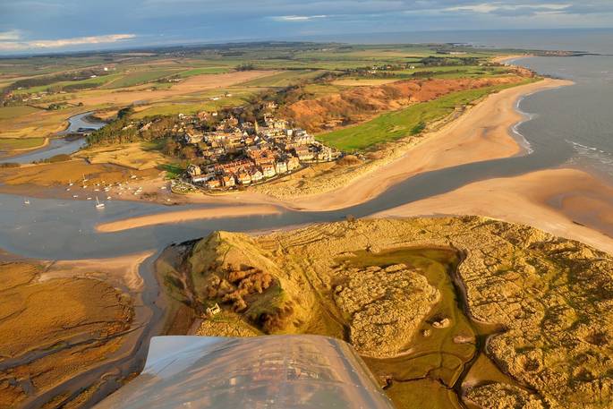 Aerial view of Alnmouth with the Huts lying on the coast in Northumberland