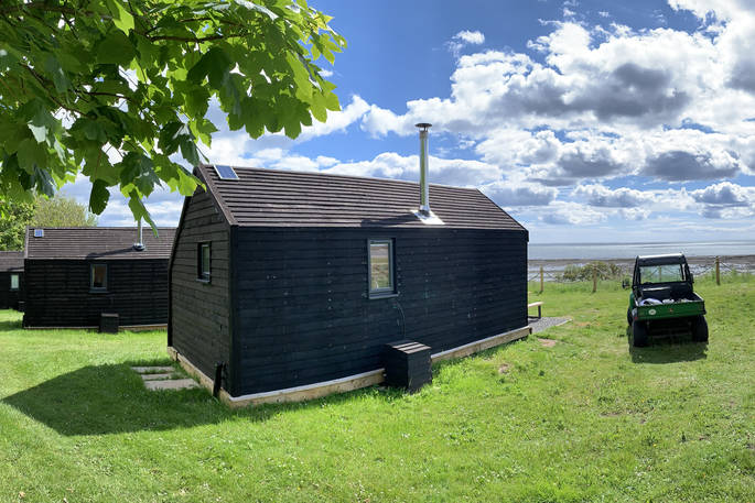 Exterior of the Alnmouth Huts with amazing views of the coast in Northumberland