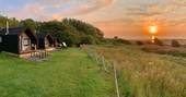 Sunsetting over the sea at Alnmouth Huts in Northumberland